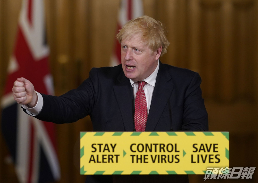 英國首相約翰遜盼聖誕前經濟活動回復正常。 AP