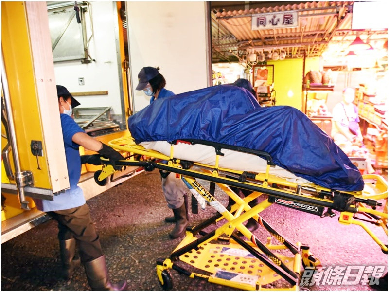 疑觸電身亡女子被舁送殮房。黃文威攝