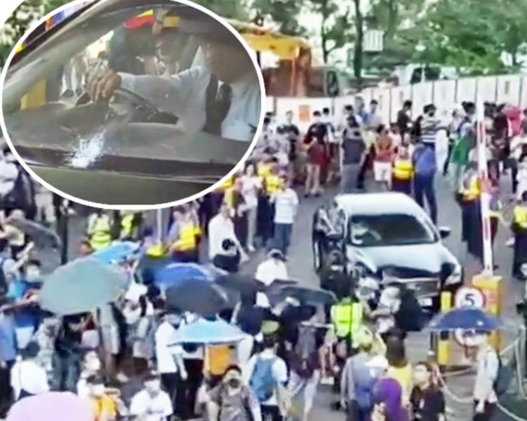 示威者包圍聶德權汽車。小圖為爆裂的擋風玻璃。有線截圖