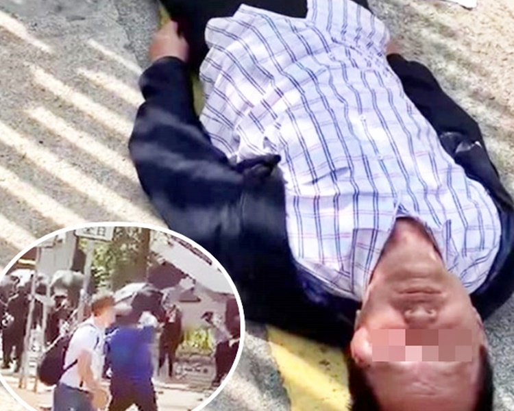 警方指一名黑衣人持相信是磚塊物件投向事主。小圖為當時在場的黑衣人。