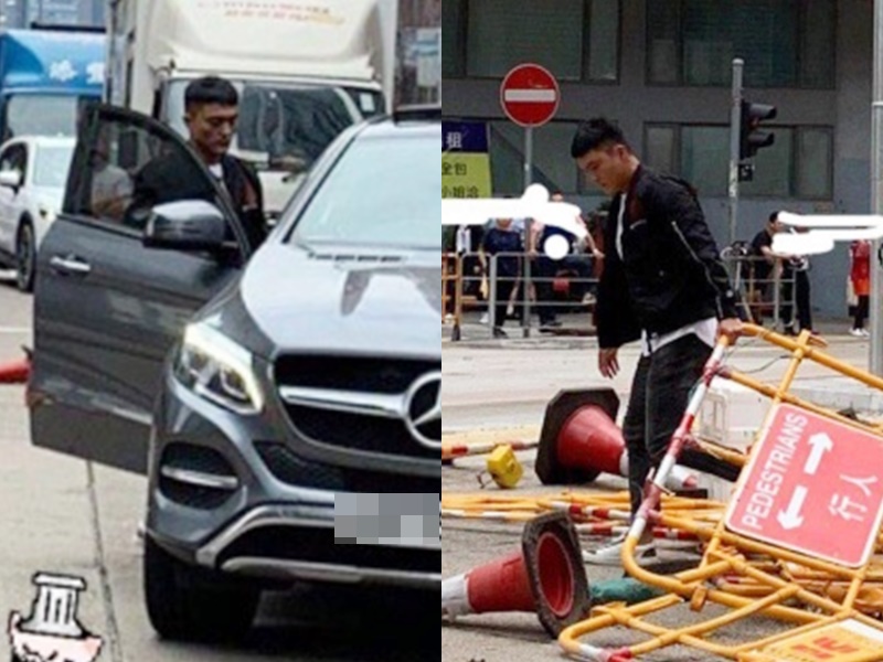楊明落車清路障。
何桂藍圖片