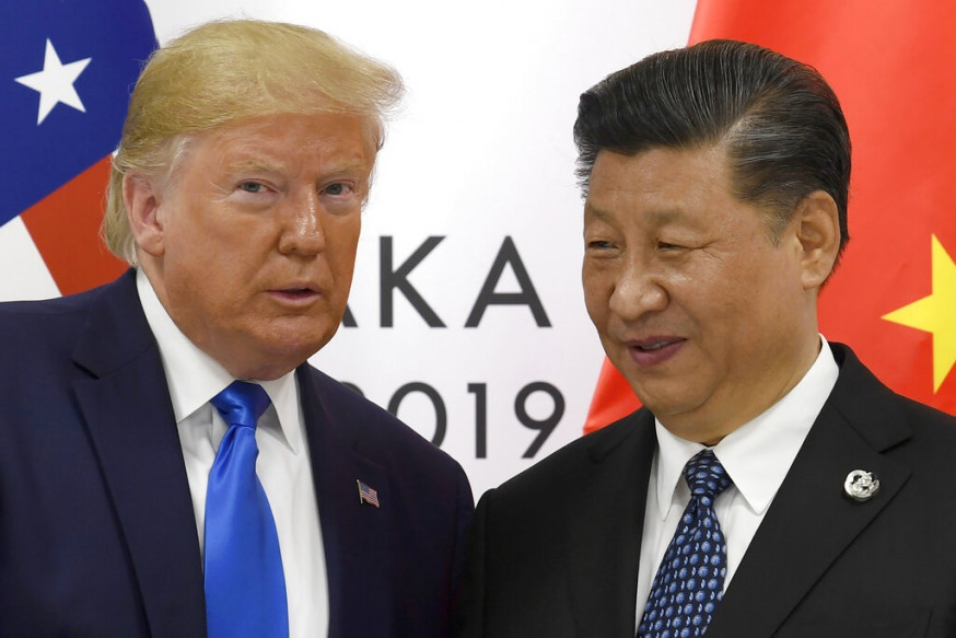 特朗普稱向習近平(右)告誡不要派兵干預香港。AP圖片