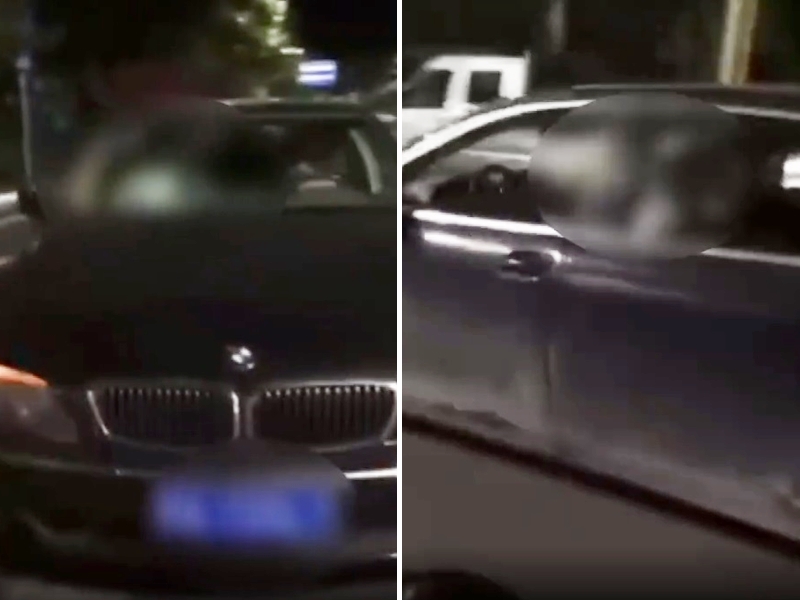 廣西省巴馬縣一輛寶馬私家車日前停在鬧區「車震」。影片截圖